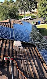 Solar panel cleaning on residential roof